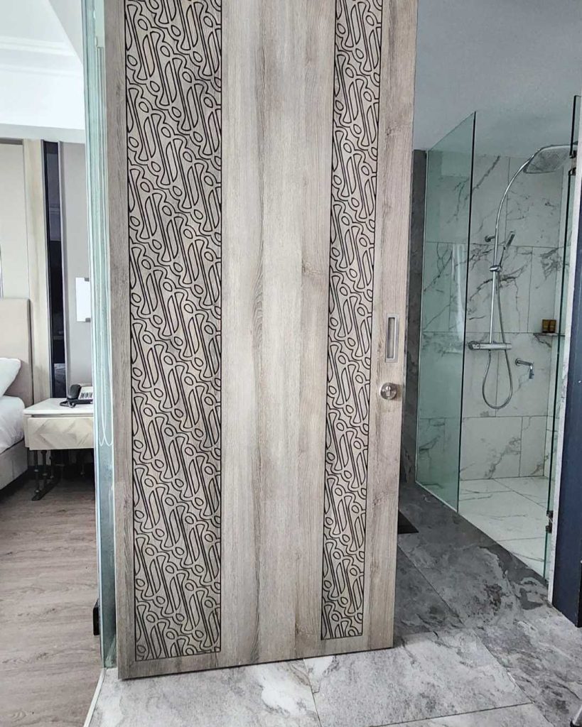 Solid batik carved bathroom door